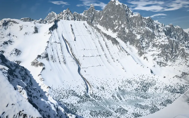 Ravenspire, a lone big-mountain face with stacked cliff bands, in SIKRUN